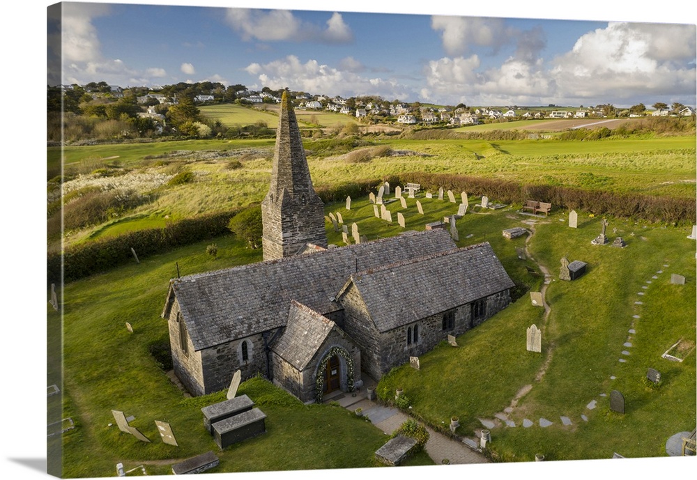 Aerial view of St Enodoc Church in the village of Trebetherick, Cornwall, England. Spring (April) 2022.