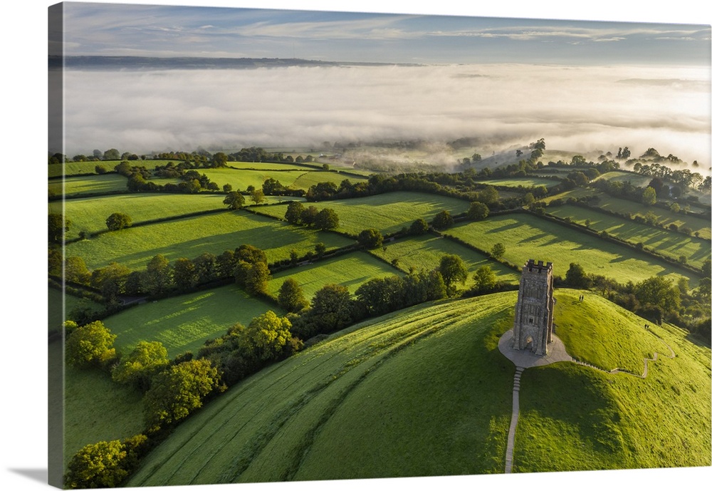 Aerial view of St. Michael's Tower on Glastonbury Tor on a misty autumn morning, Somerset, England. Autumn (September) 2020.