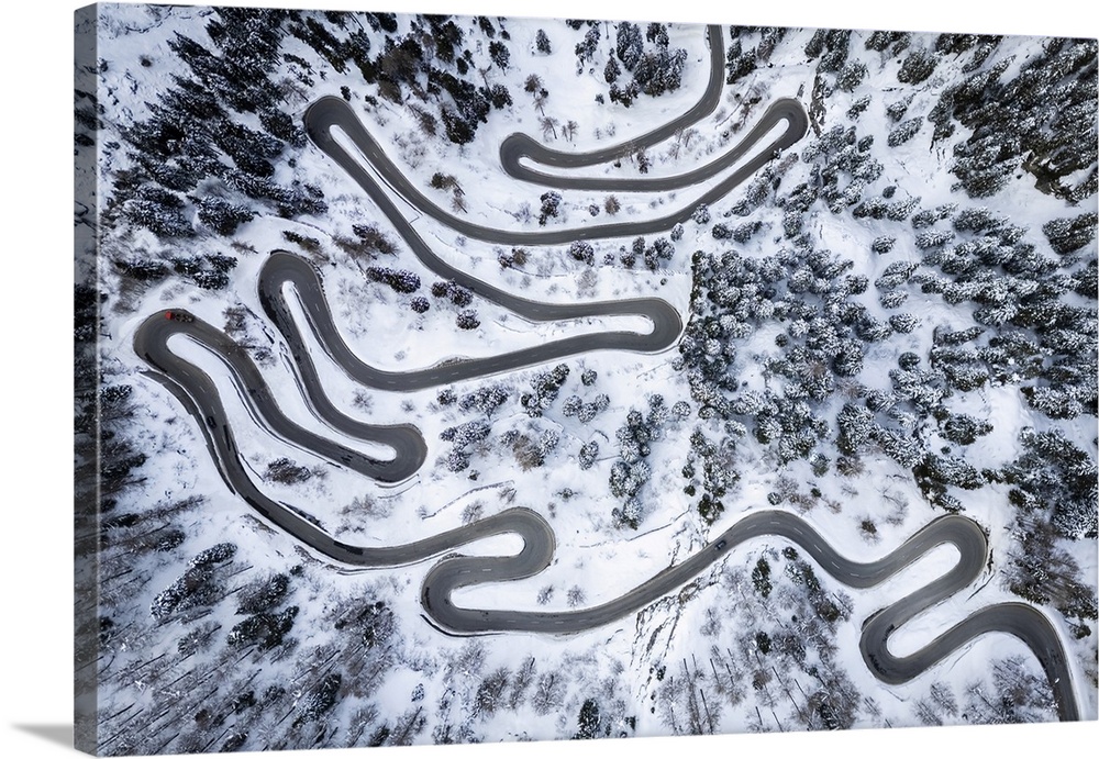 Aerial view of the Maloja Pass covered in snow. Maloja, Bregaglia, Graubunden, Engadin, Switzerland.