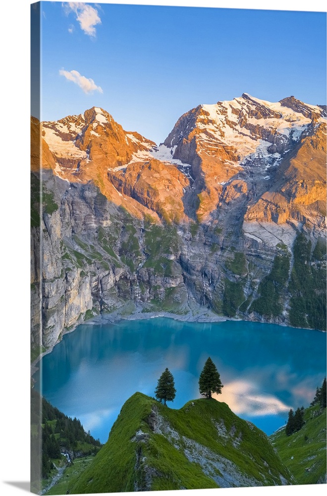 Aerial view of the sunset on the mountains surrounding Oeschinensee. Kandersteg, Bernese Oberland, Frutigen-Niedersimmenta...