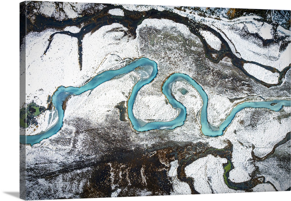 Aerial view of turquoise water of a river in a snowy landscape, Predarossa, Valmasino, Lombardy, Italy