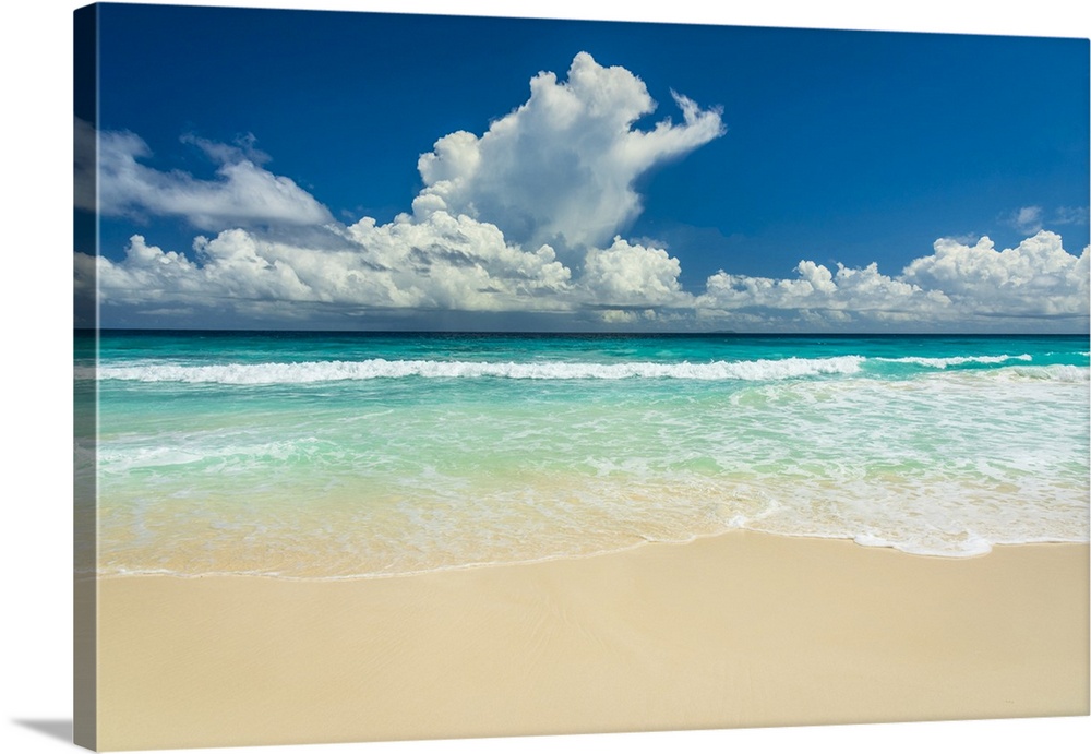 Africa, Seychelles, La Digue. Beach, sand, waves, clouds at Grand Anse.