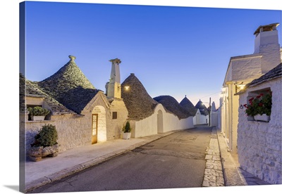 Alley Between White Trulli Houses At Dusk, Unesco World Heritage Site, Apulia, Italy