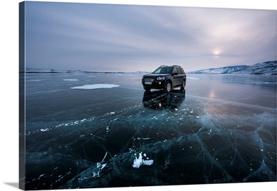An Offroad Car Over A Flat Ice At The Lake Baikal, Irkutsk Region, Siberia, Russia