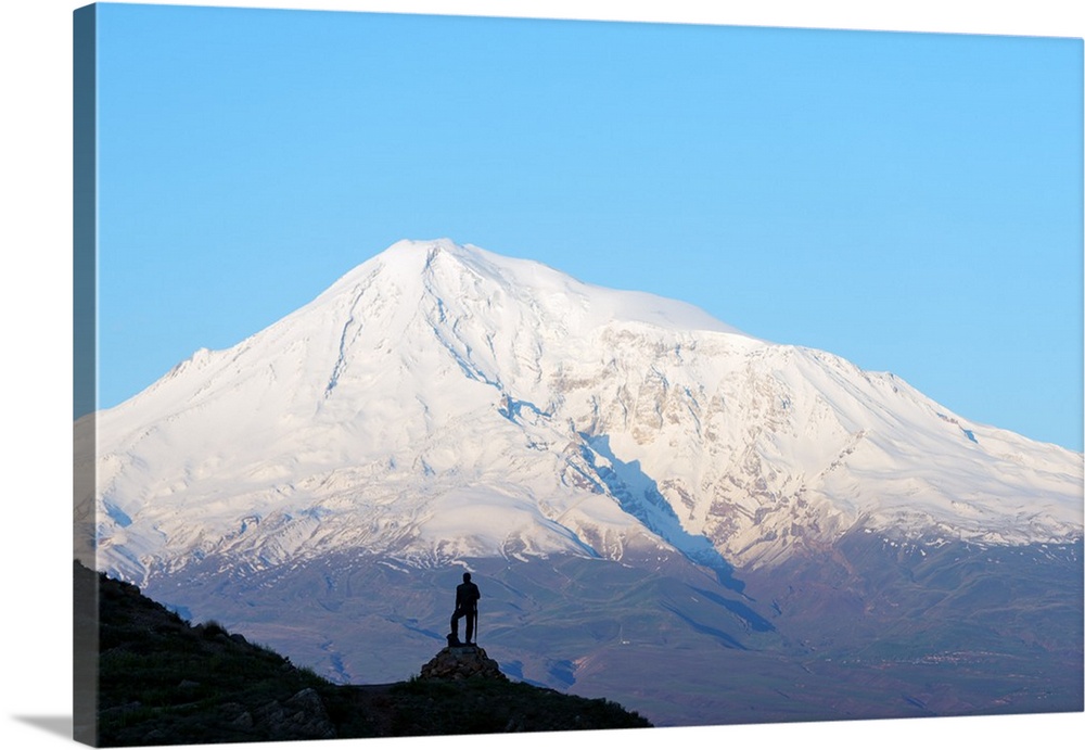 Eurasia, Caucasus region, Armenia, statue silhouetted against Mount Ararat highest mountain in Turkey.