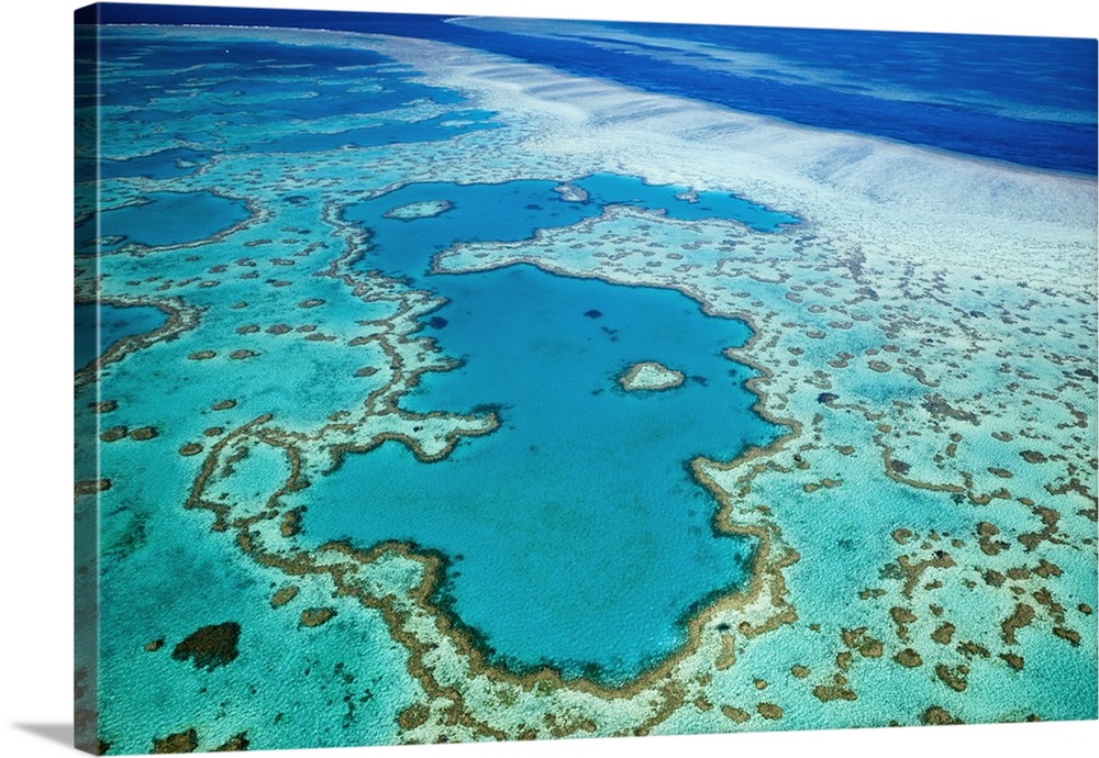 Australia, Queensland, Whitsundays, Great Barrier Reef Marine Park. Aerial view of Heart Reef, a heart-shaped coral format...