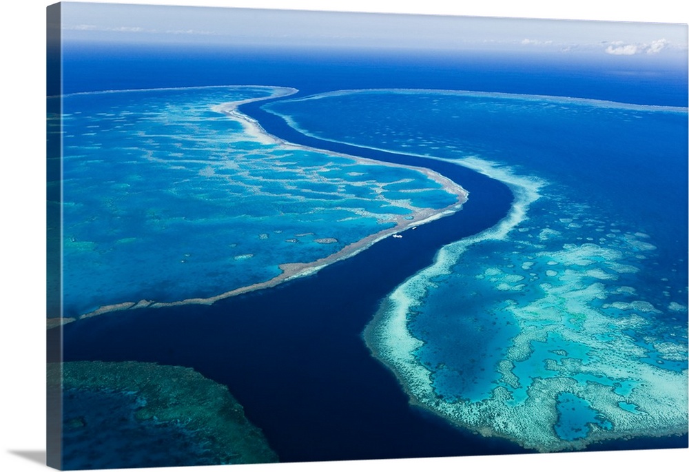 Australia, Queensland, Whitsundays, Great Barrier Reef Marine Park. Aerial view of The River, a 200 ft deep channel runnin...