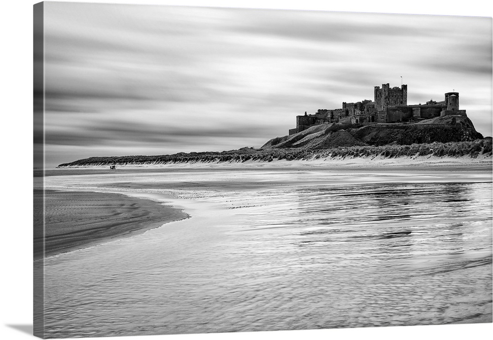 Bamburgh castle and beach at low tide, Northumberland, UK