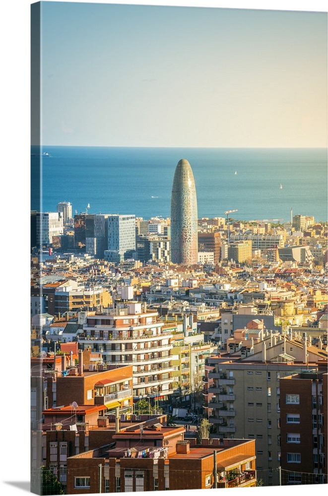 Barcelona, Catalonia, Spain, Southern Europe. High angle view of the city with the Agbar Tower and the Mediterranean sea.