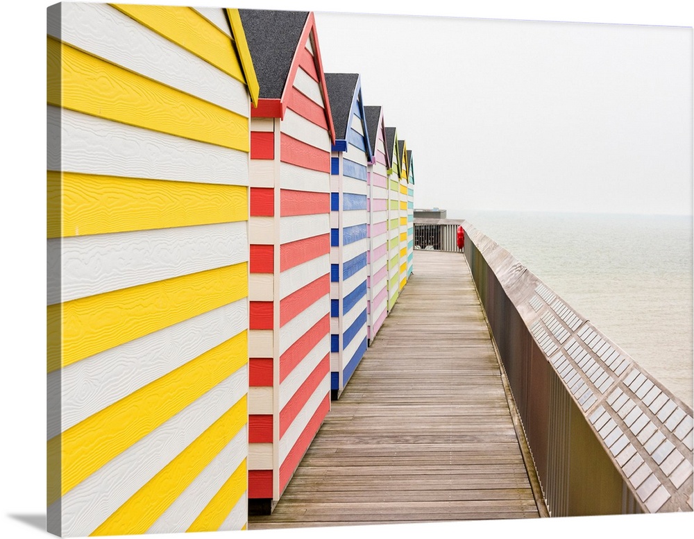 Beach huts on Hastings Pier, Sussex, England.