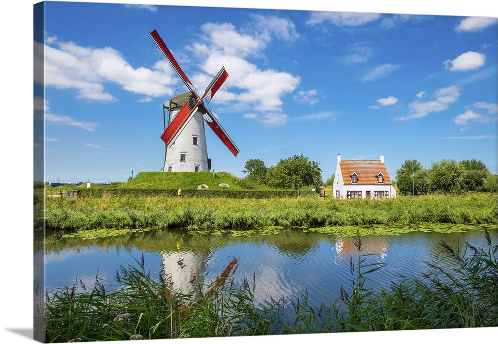 Belgium, West Flanders (Vlaanderen), Damme. Hoeke Mill (Hoekemolen) windmill on the Damse Vaart canal.