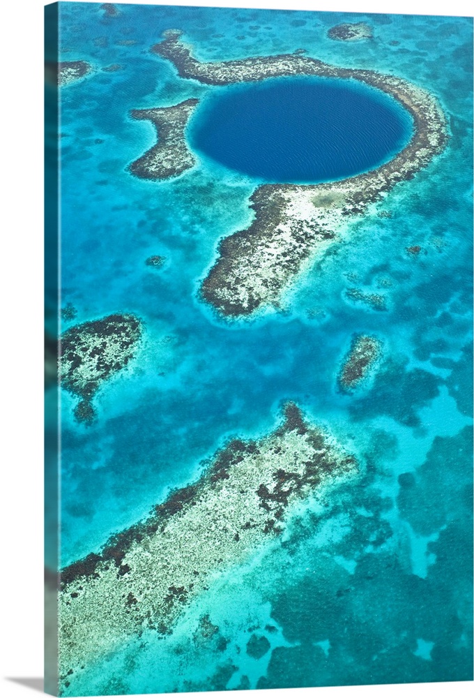 Central America, Belize, Lighthouse atoll, the Great Blue Hole, aerial shot of the Blue Hole. The hole is a marine cenote ...
