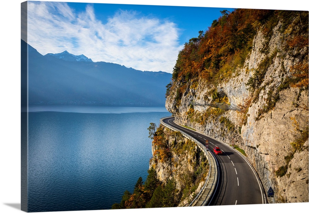 Bending road by lake Thun, Berner Oberland, Switzerland.