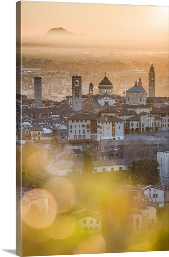 Bergamo, Lombardy, Italy. High angle view over Upper Town (Citta Alta) at sunrise.