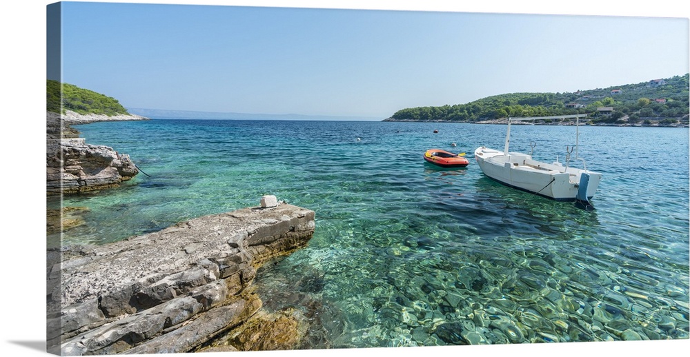 Boats at the little pier of Tankaraca cove in summer. Vela Luka, Korcula island, Dubrovnik - Neretva county, Croatia.