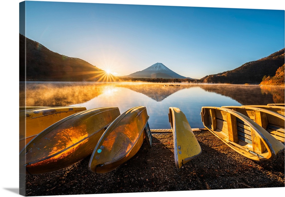 Boats moored at lake Shoji and Mt. Fuji, Yamanashi Prefecture, Japan.