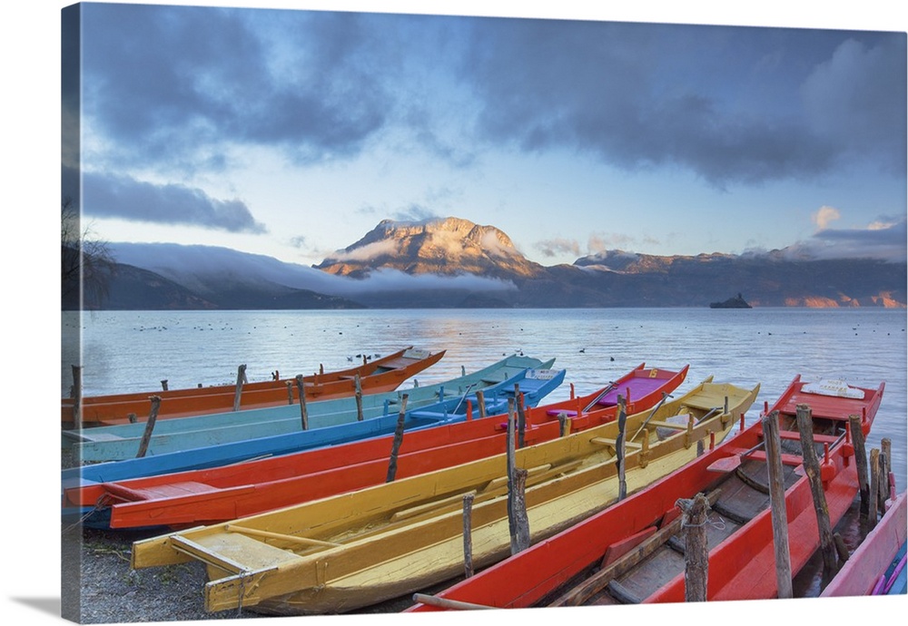 Boats on Lugu Lake at dawn, Yunnan, China.