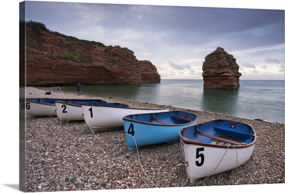 Boats pulled up on the shingle at Ladram Bay on the Jurassic Coast, Devon, England. Autumn (September)