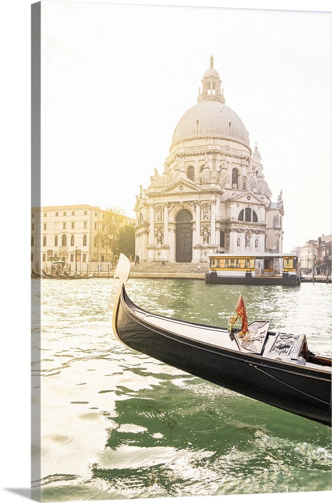 Bow of a gondola sailing in the Venetian Lagoon with Santa Maria della Salute Basilica on background, Venice, Veneto, Italy