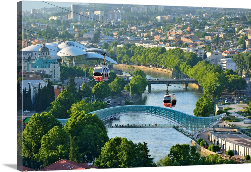 Bridge of Peace and the Mtkvari river. The famous Cable Car above. Tbilisi, Georgia. Caucasus.