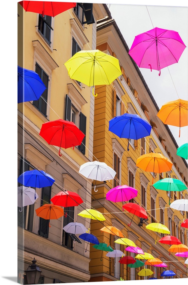Brightly colored floating umbrellas, Genoa, Liguria, Italy.