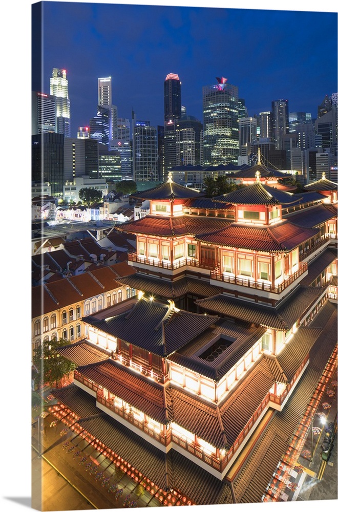 Buddha Tooth Relic Temple and skyscrapers at dusk, Chinatown, Singapore.