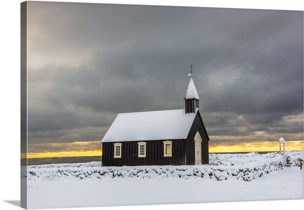 Budir, Snaefellsnes Peninsula, Western Iceland, Iceland. Black church surrounded by the snow in winter.
