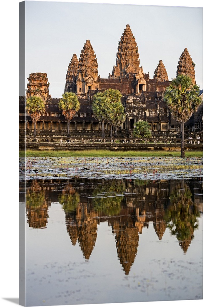 Cambodia, Angkor Wat, Siem Reap Province. The magnificent Khmer temple of Angkor Wat bathed in late afternoon sunshine wit...
