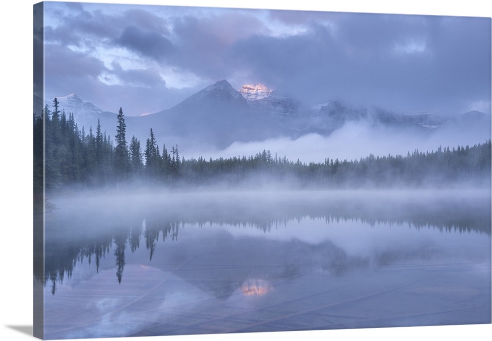 Misty morning in the Canadian Rockies, Herbert Lake, Banff National Park, Alberta, Canada. Autumn (September) 2016.