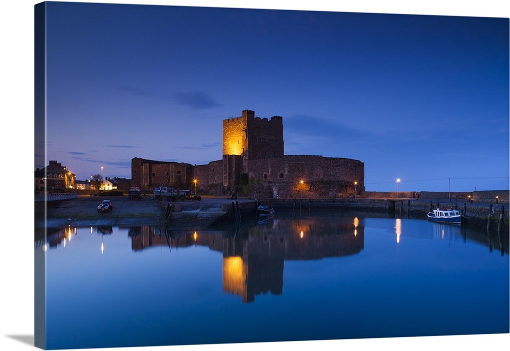 UK, Northern Ireland, County Antrim, Carrickfergus, Carrickfergus Castle, 1177, Ireland's oldest Norman castle, dusk.