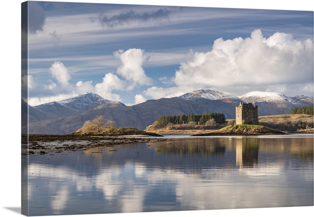 Castle Stalker reflected on Loch Laich, and inlet off Loch Linnhe in the Scottish Highlands, Scotland.