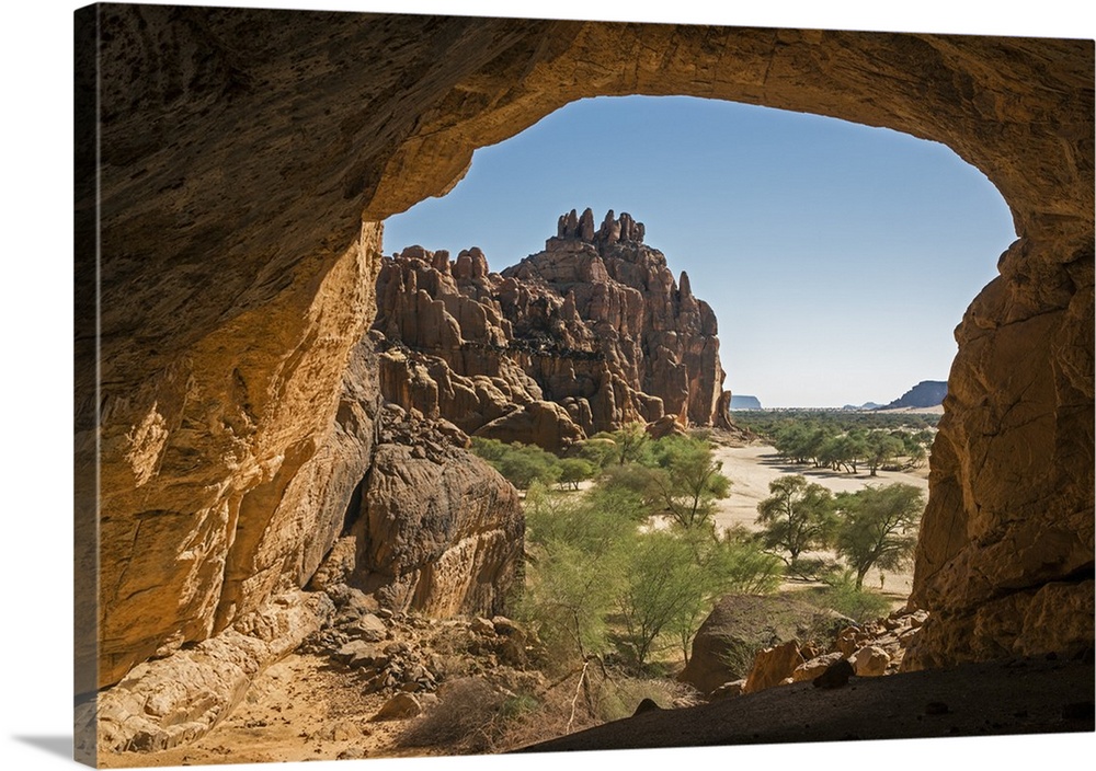 Chad, Wadi Archei, Ennedi, Sahara. A huge sandstone cave with a view down Wadi Archei.