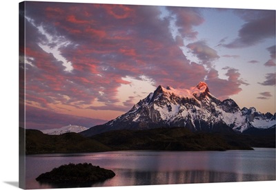 Chile, Sunrise over Cerro Paine Grande with Lake Pehoe in the foreground