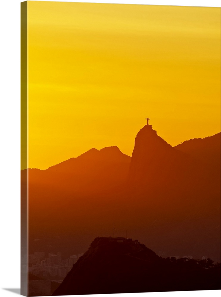 Brazil, State of Rio de Janeiro, Christ the Redeemer on top of the Corcovado Mountain at sunset viewed from Parque da Cida...