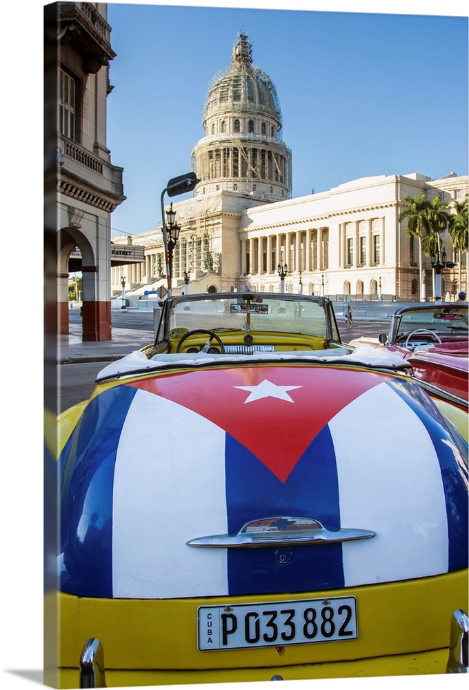 Classic American car with the Cuban flag painted in it's boot, Parque Central, Havana, Cuba.