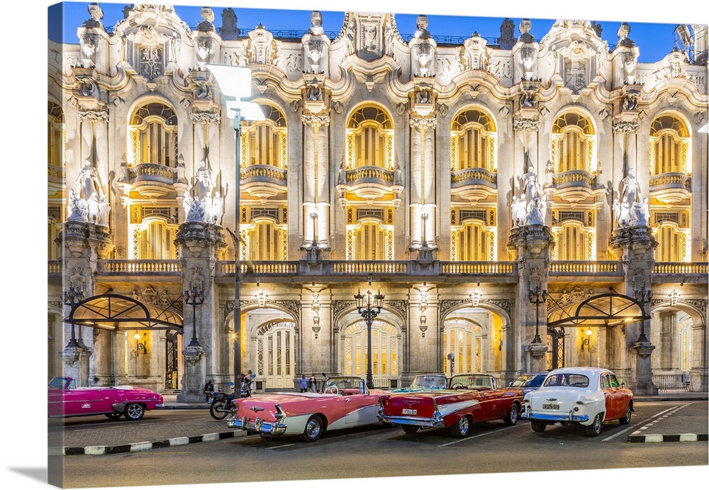 Classic cars parked in front of the Gran Teatro de La Habana (otherwise known as Grand Theatre of Havana) at night, Centro...