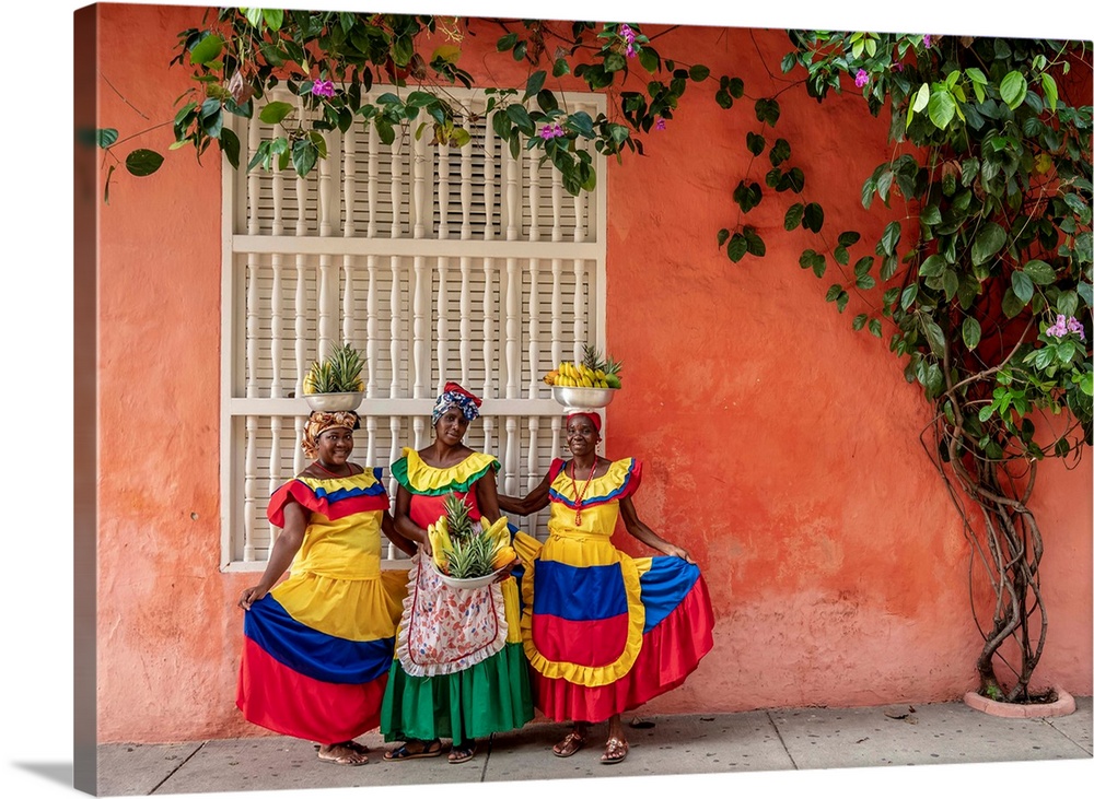 Colourful Palenqueras selling fruits on the street of Cartagena, Bolivar Department, Colombia (MR).