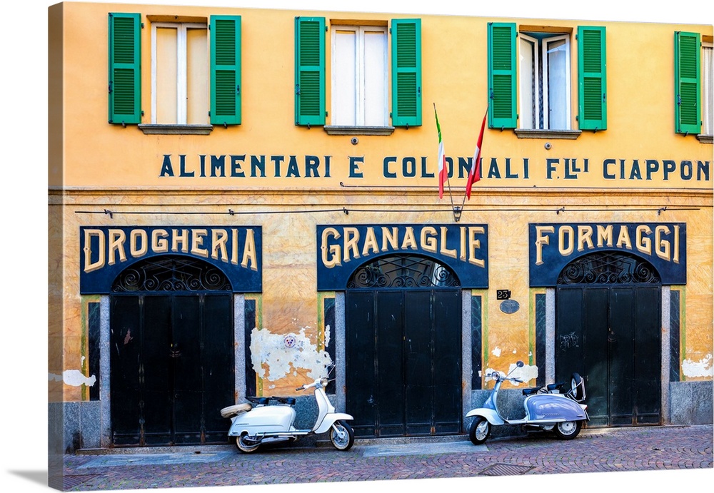 Couple of Lambretta Innocenti scooter parked at the old grocery, Morbegno, province of Sondrio, Valtellina, Lombardy, Italy.