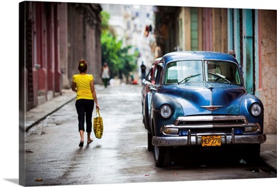 Cuba, Havana, Havana Vieja view of Old Havana street with 1950's-era US car