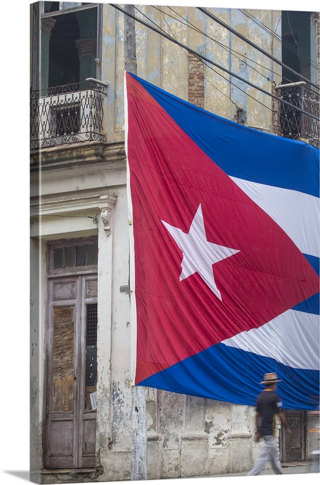 Cuba, Huge Cuban flag hanging across buildings in a street in  Santa Clara, after the death of Fidel Castro