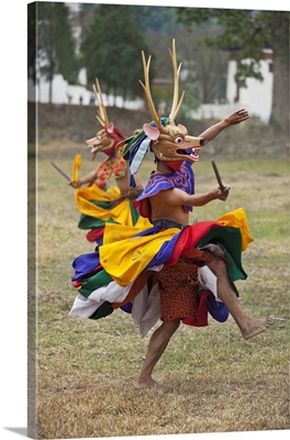 Dancers perform Shazam Tam, the Dance of the Four Stags outside Punakha Dzong