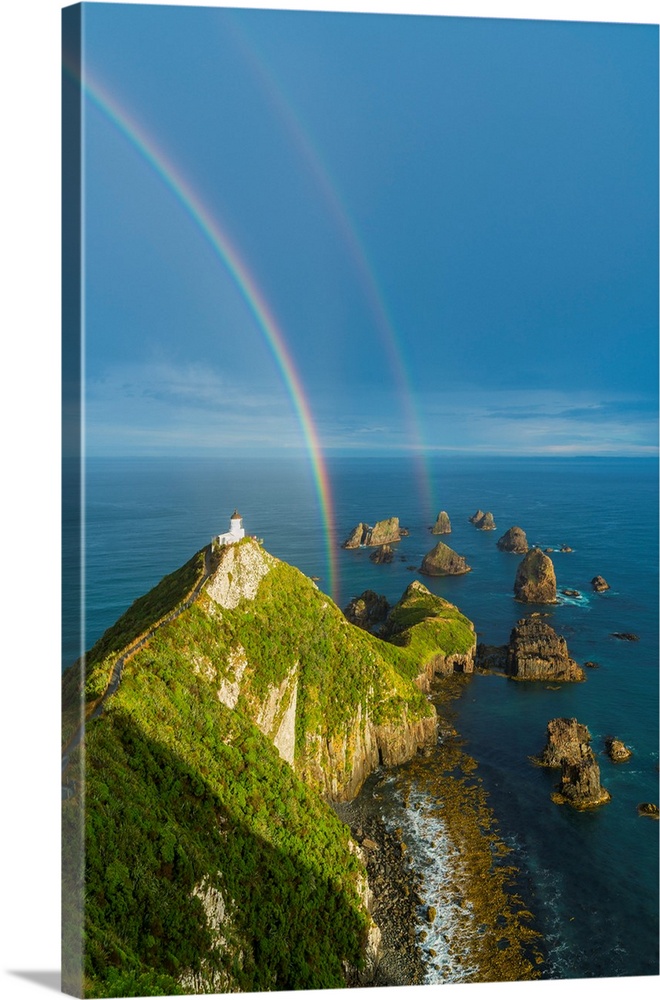Double rainbow over Nugget Point lighthouse after the storm. Ahuriri Flat, Clutha district, Otago region, South Island, Ne...