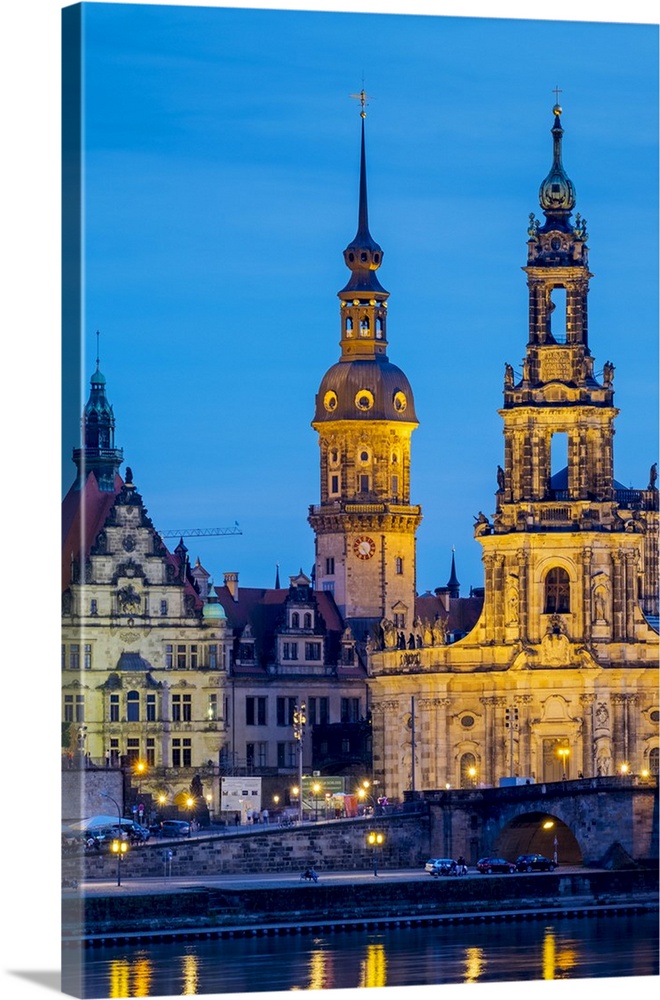 Germany, Saxony, Dresden, Altstadt (Old Town). Dresden skyline, historic buildings along the Elbe River at night.