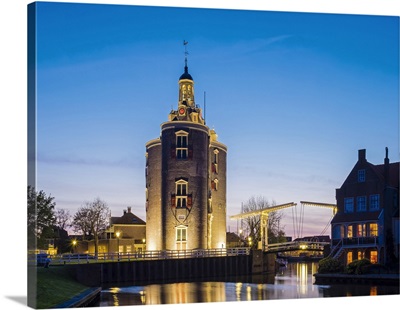 Drommedaris tower, historic former city gate at the entrance to Oude Haven at dusk