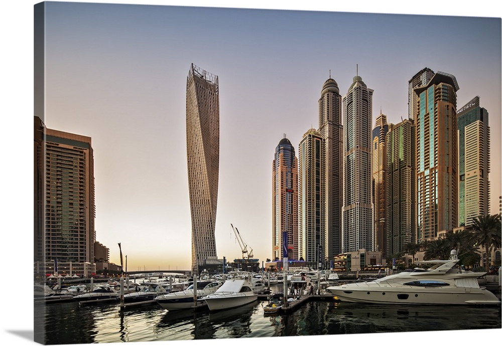 Dubai Marina at sunset with the Cayan Tower (Infinity Tower), the Dubai Marriott Harbour Hotel and Suites and various resi...