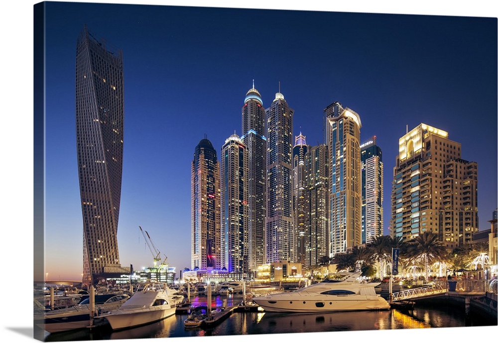 Dubai Marina at twilight with the Cayan Tower (Infinity Tower), the Dubai Marriott Harbour Hotel and Suites and various re...