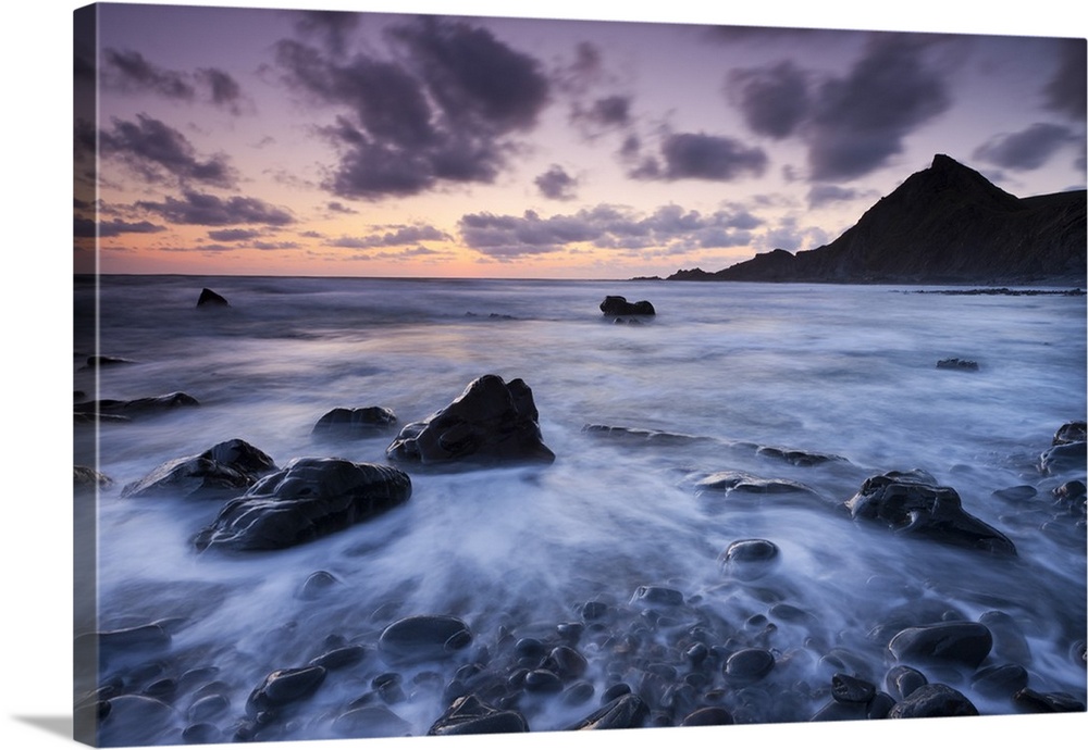 Dusk on the rocky shores of Speke's Mill Mouth in North Devon, England. Summer