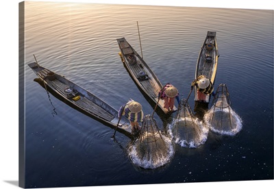 Elevated View Of Three Fishermen Catching Fish At Sunrise, Myanmar