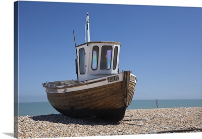 England, Kent, Deal, Old wooden fishing boat on the shingle beach at Deal
