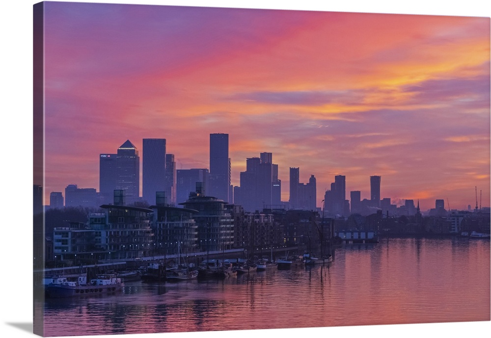 England, London, Docklands, River Thames and Canary Wharf Skyline at Dawn